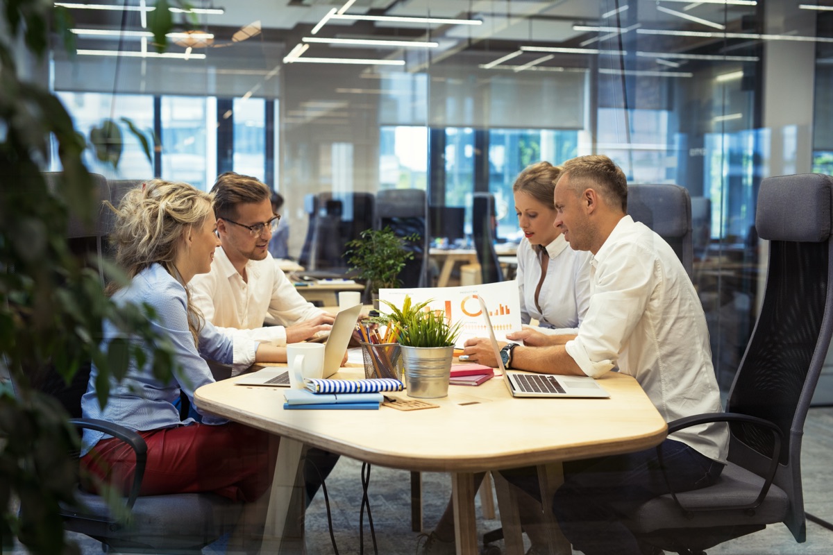 The Assured Technologies team working together in their Spring Mountain office